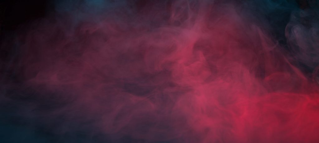 Colorful smoke on a black background closeup